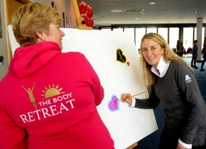 Charity boot camp day at Dorney Lake Julie Brealey (l) and artist Steffi Goddard (r) painting hearts on the LoveHug